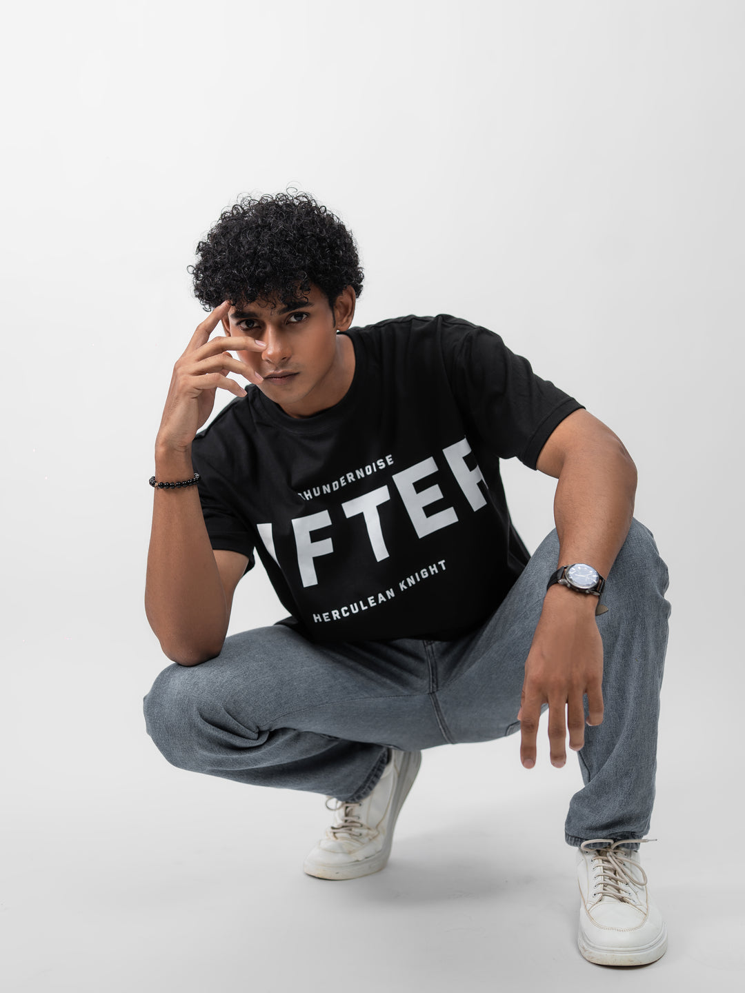 Model wearing black Galactic Knight drop shoulder tee by Herculean Knight, 100% cotton, size XL, streetwear + gym fusion