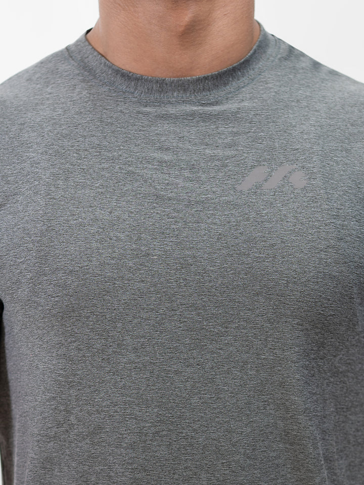Male athlete 5 ft 8 in wearing size S Herculean Metal Grey Dri-Blend Training Tee, hands on hips, front view against white background.