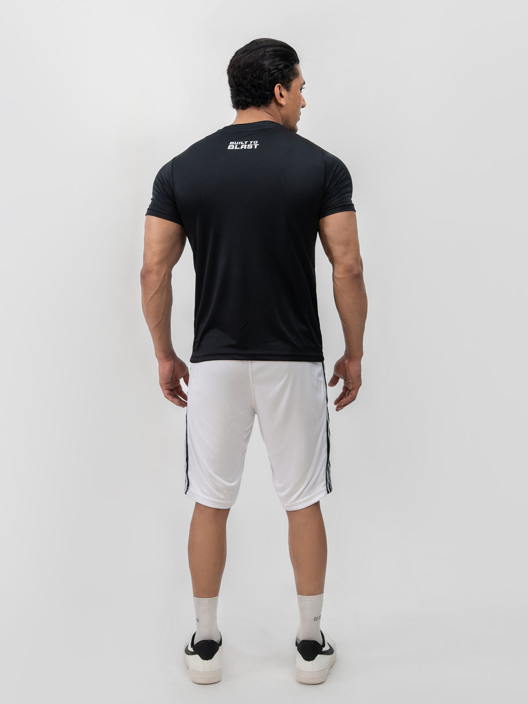 Male model wearing Knights' Performance Tee Mystic Black, size S, front view