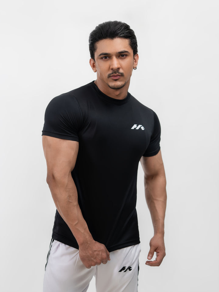 Male model wearing Knights' Performance Tee Mystic Black, size S, front view