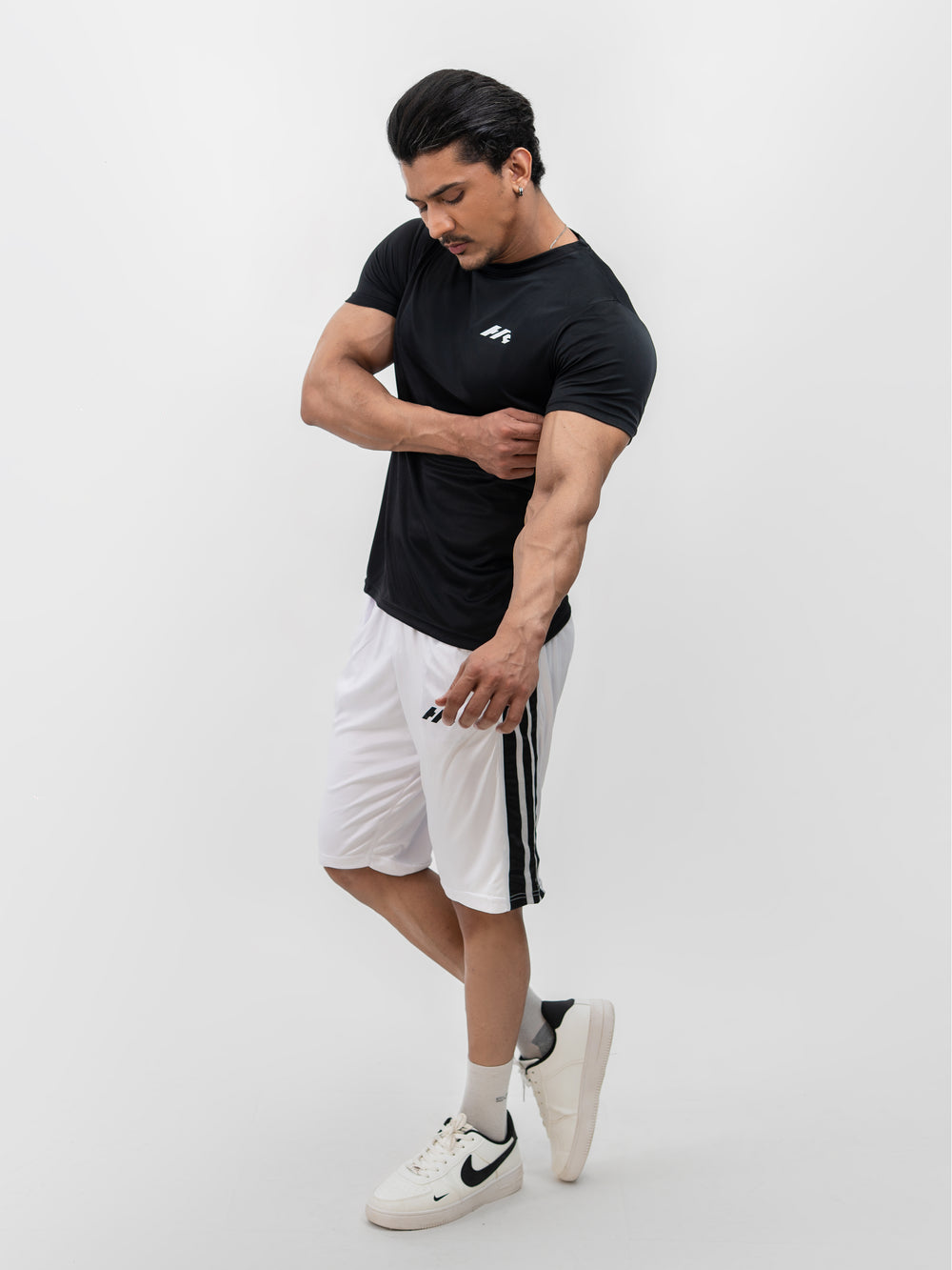 Male model wearing Knights' Performance Tee Mystic Black, size S, front view