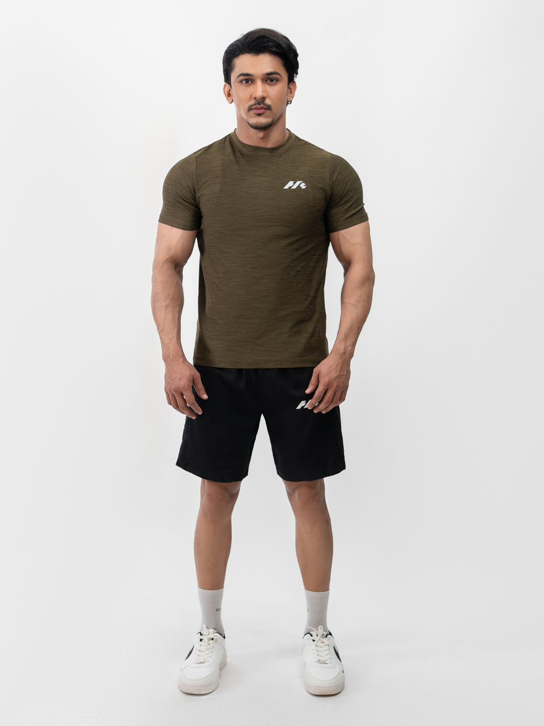 Close-up of moisture-wicking Lycra fabric on Herculean olive workout shirt