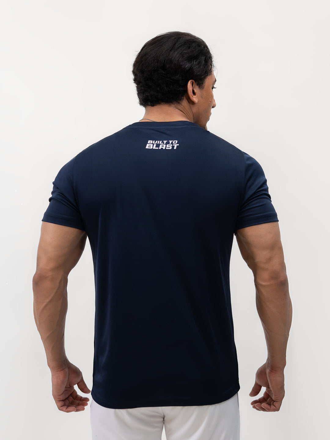 Male athlete 5 foot 8 wearing Ocean Blue dry-fit Knights’ Performance Tee in size S