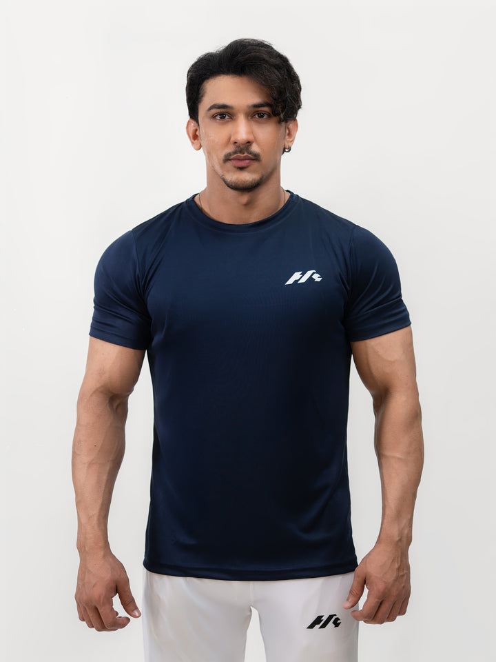 Male athlete 5 foot 8 wearing Ocean Blue dry-fit Knights’ Performance Tee in size S