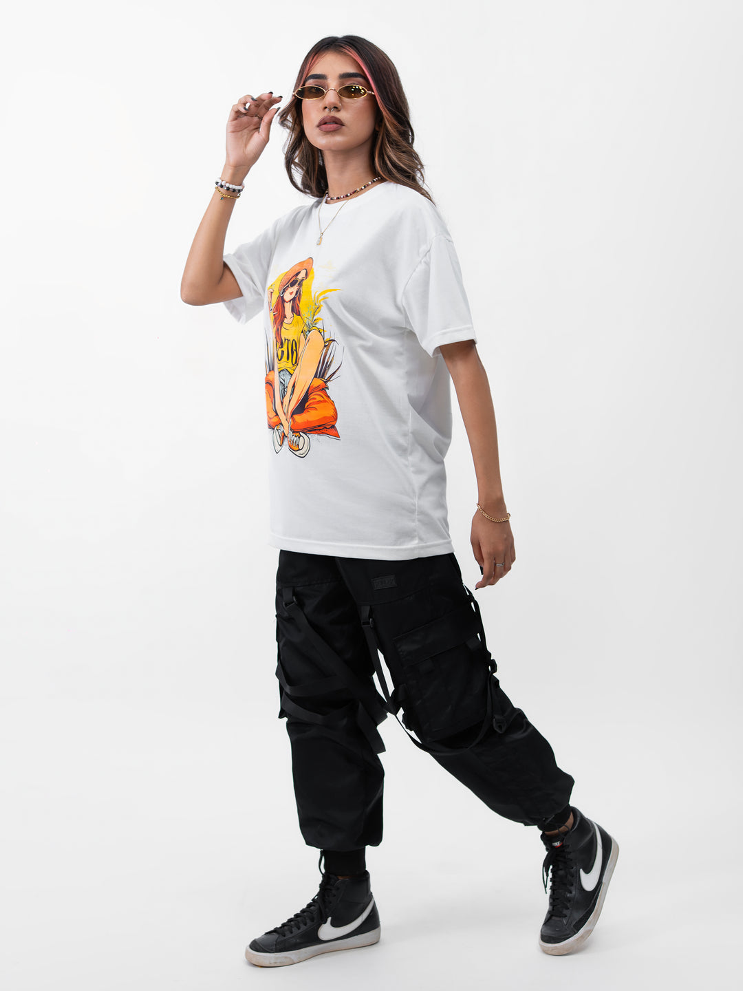 Model wearing Herculean Knight Mystique Woman white oversized drop-shoulder graphic T-shirt, front view